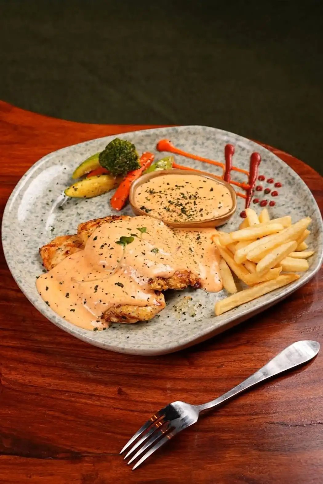 Seared duck breast with fries, roasted vegetables and creamy sauce